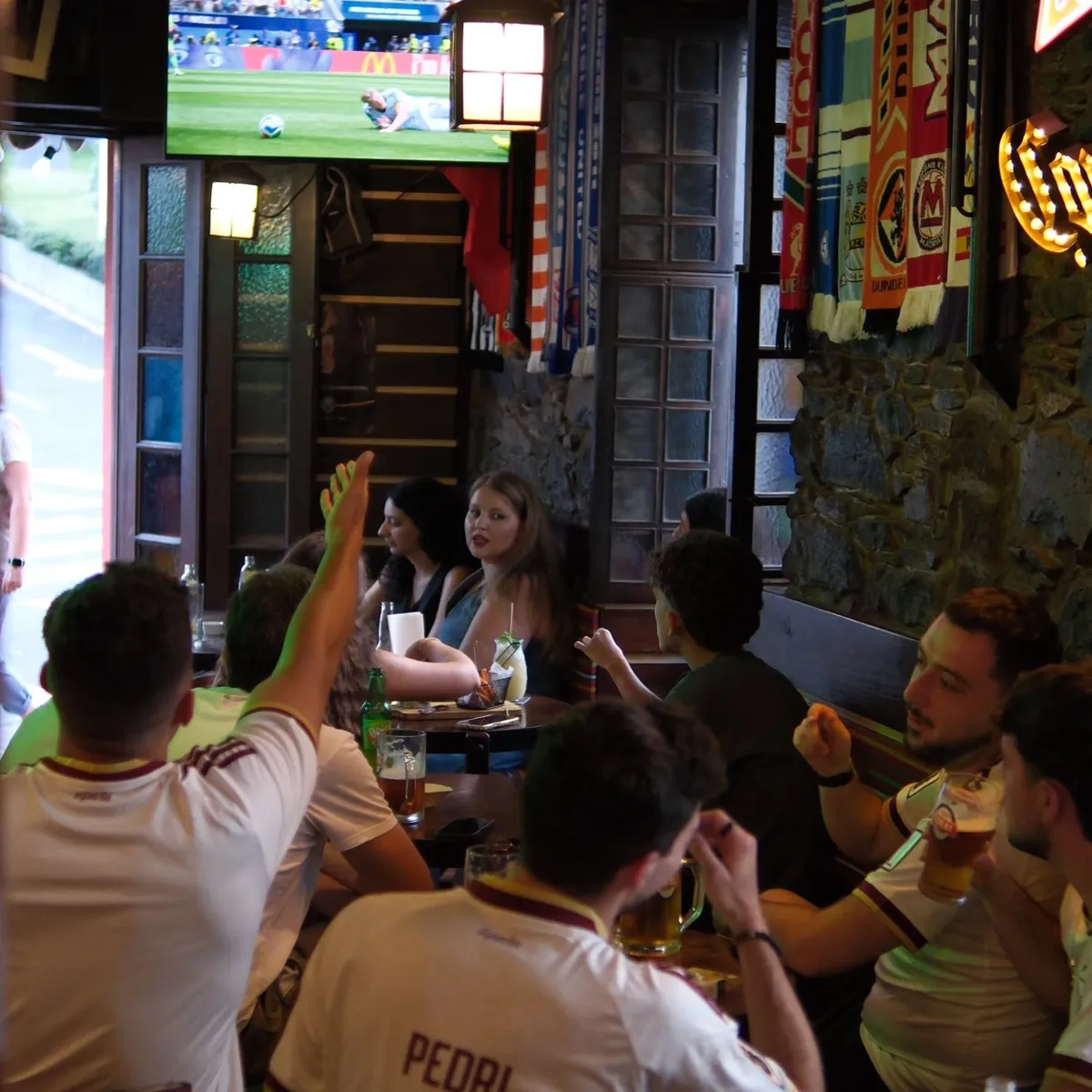 A full room watching football inside Local Pub